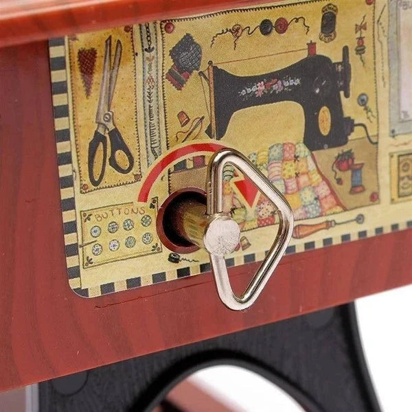 Wind-up crank on the side of the music box
