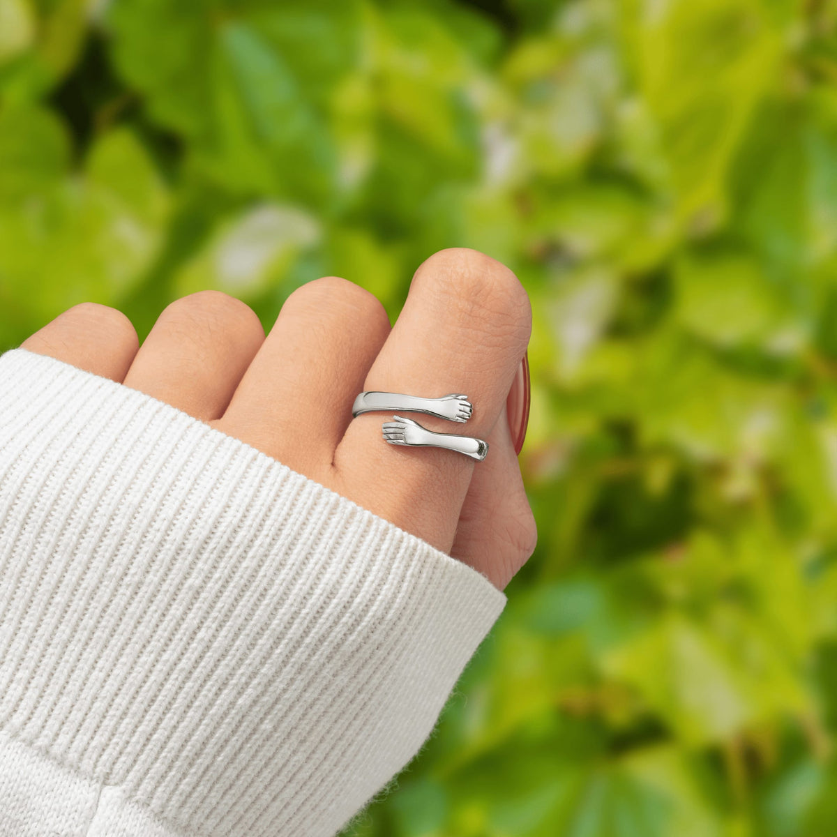 Huggi hug ring worn on the finger