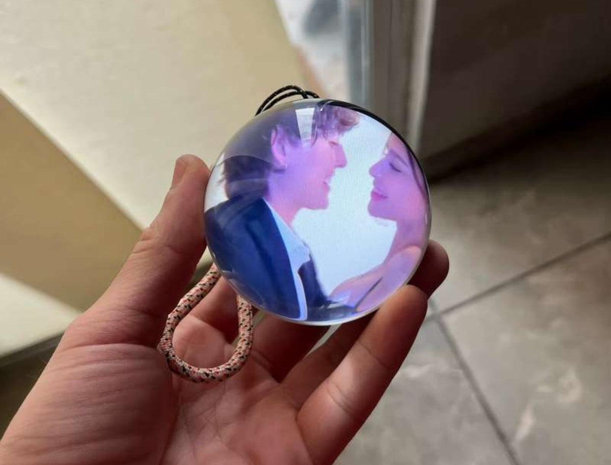 Orbie memory ornament held by its cord