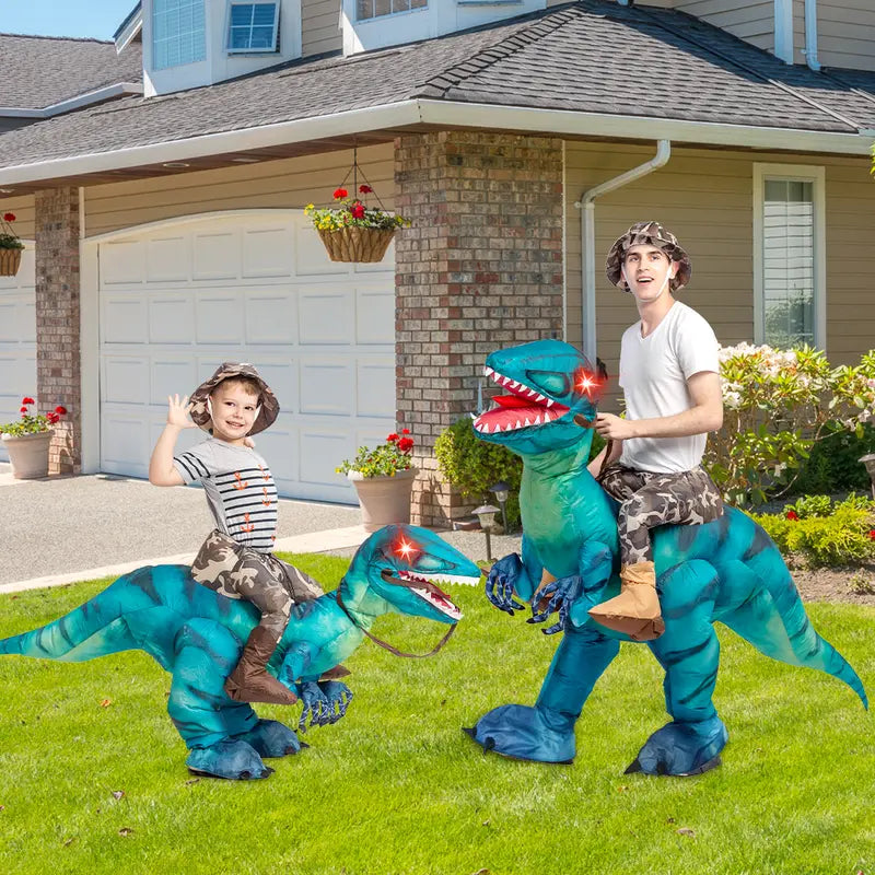 Parent and child riding blue Raptie dinosaur costumes
