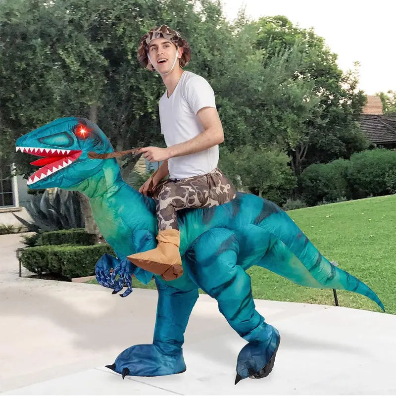 Adult riding a blue Raptie dinosaur costume outdoors